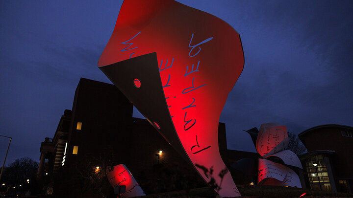 A page from "Torn Notebook" is lit up in scarlet for Glow Big Red.