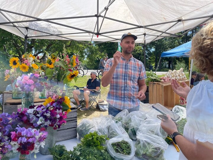 Russell Rolffs sells flowers at local farmers market in Wisconsin