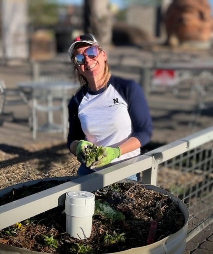 Carla McCullough Dittman plants a garden